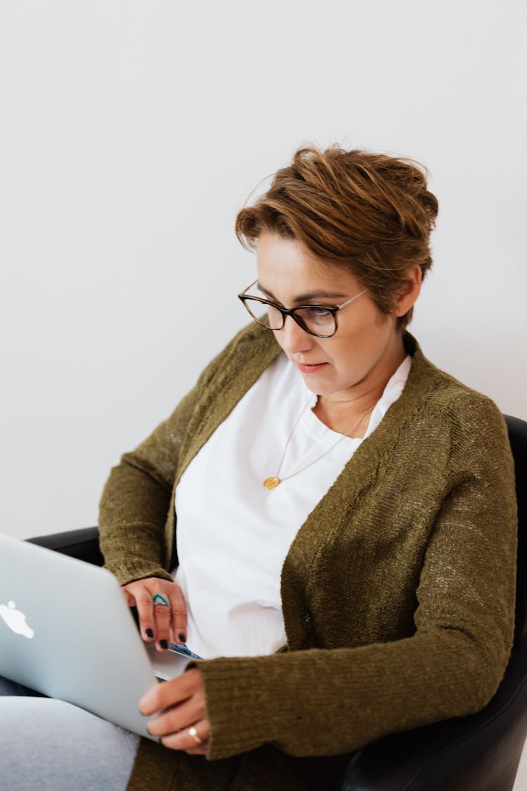 Pensive Lady Watching Movie On Laptop At Home