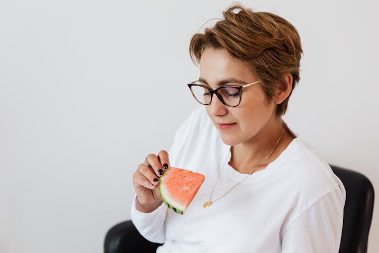 Optimistic Female With Piece Of Ripe Watermelon