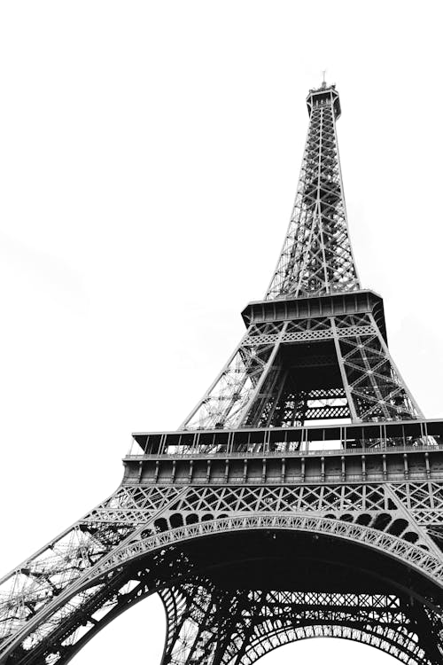 From below of metal tower in center of Paris most recognizable architectural landmark Eiffel Tower