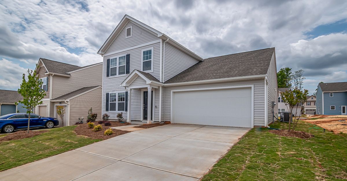 Beautiful modern detached house with garage and newly landscaped lawn.