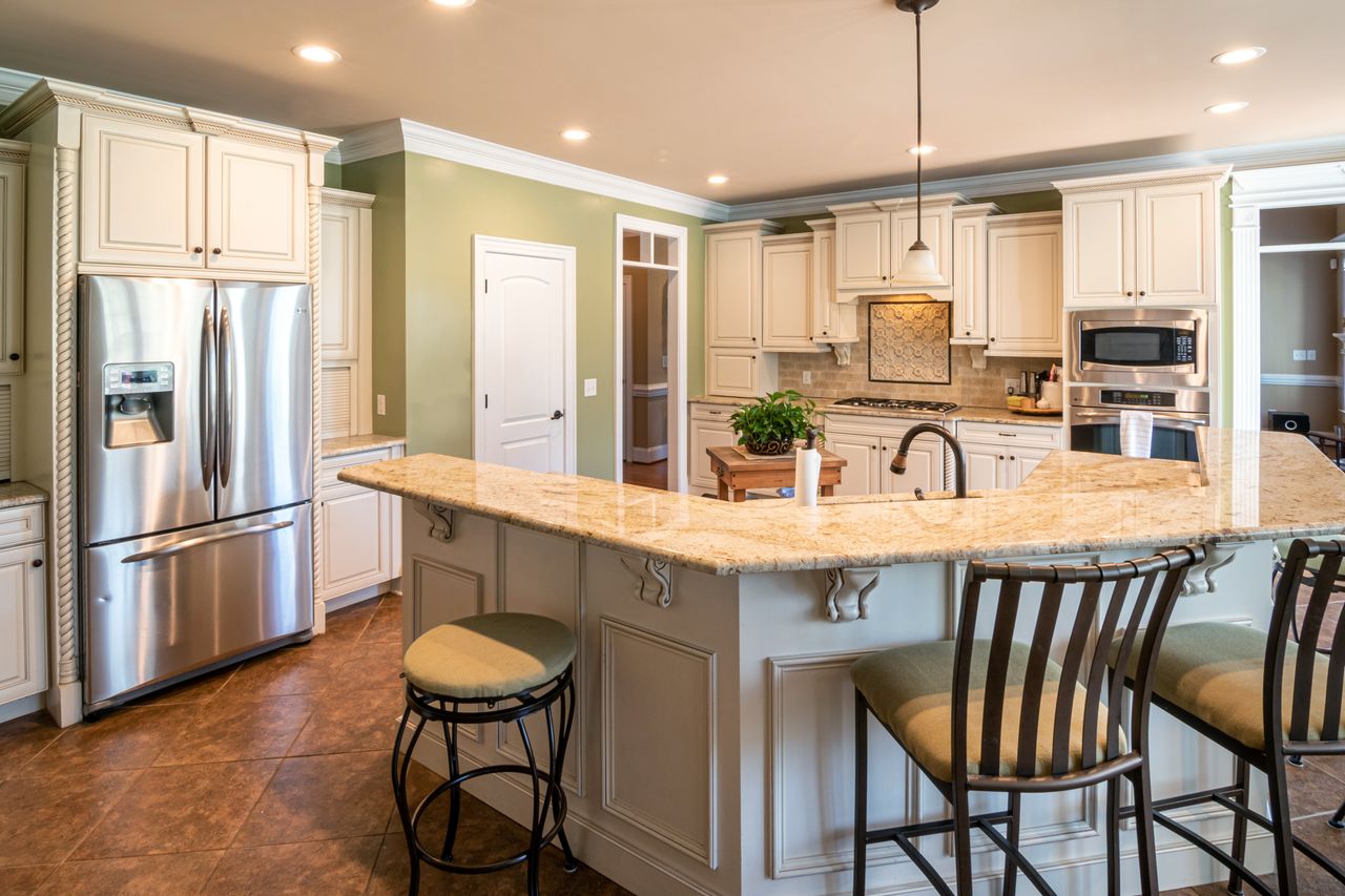 modern-appliances-rustic-kitchen Modern stainless steel appliances in a farmhouse kitchen