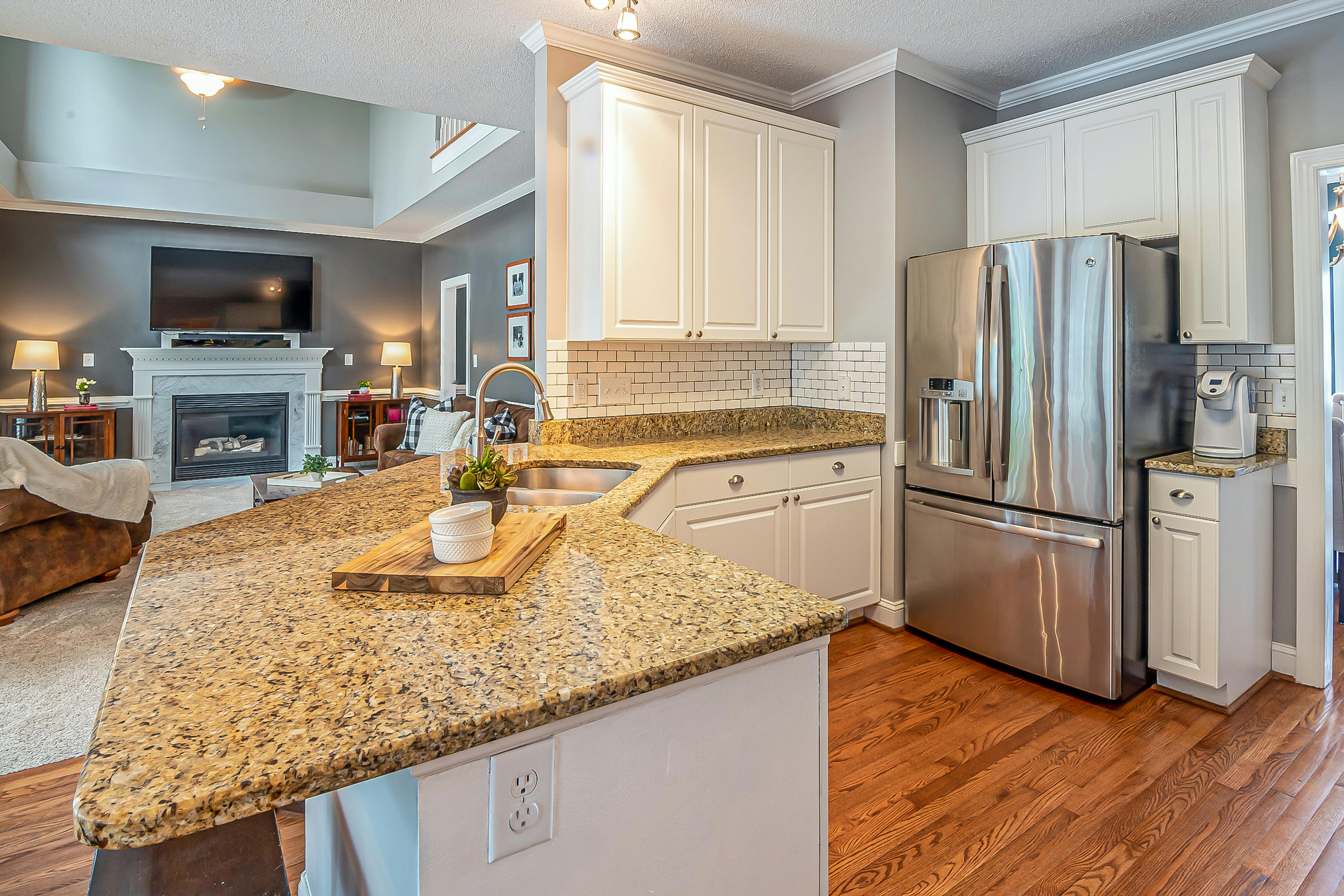 luxury kitchen with stone facade fireplace and granite countertops - double wides for sell