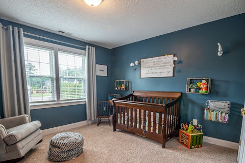 Brown Wooden Crib Near Window