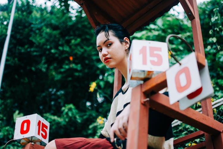 Young Woman On Wooden Chair For Judge