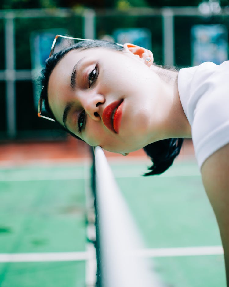 Confident Young Female Athlete In Tennis Playground