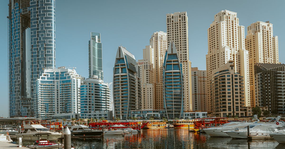 Panoramic view of Dubai Marina showing iconic skyscrapers and yachts