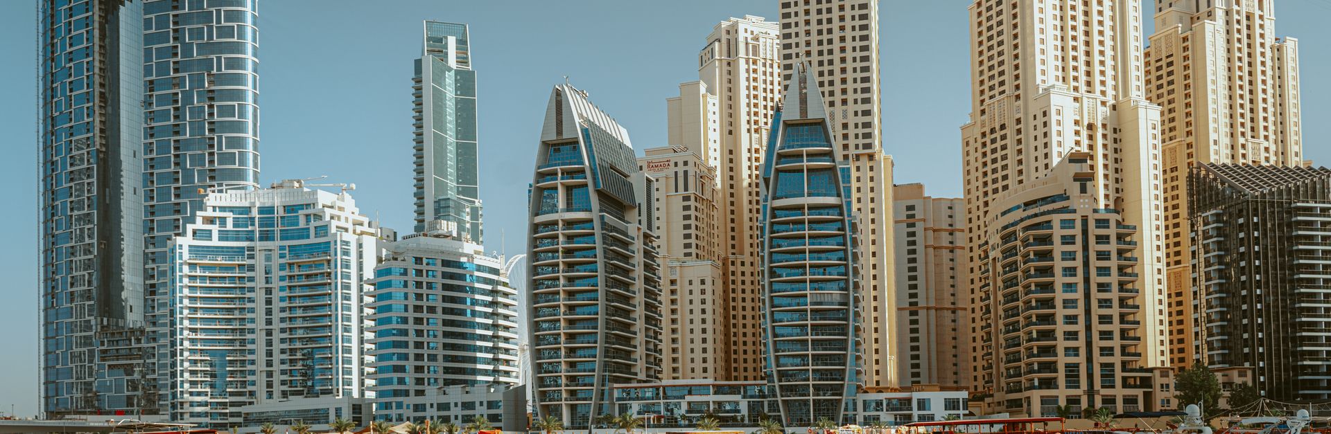 Panoramic view of Dubai Marina showing iconic skyscrapers and yachts