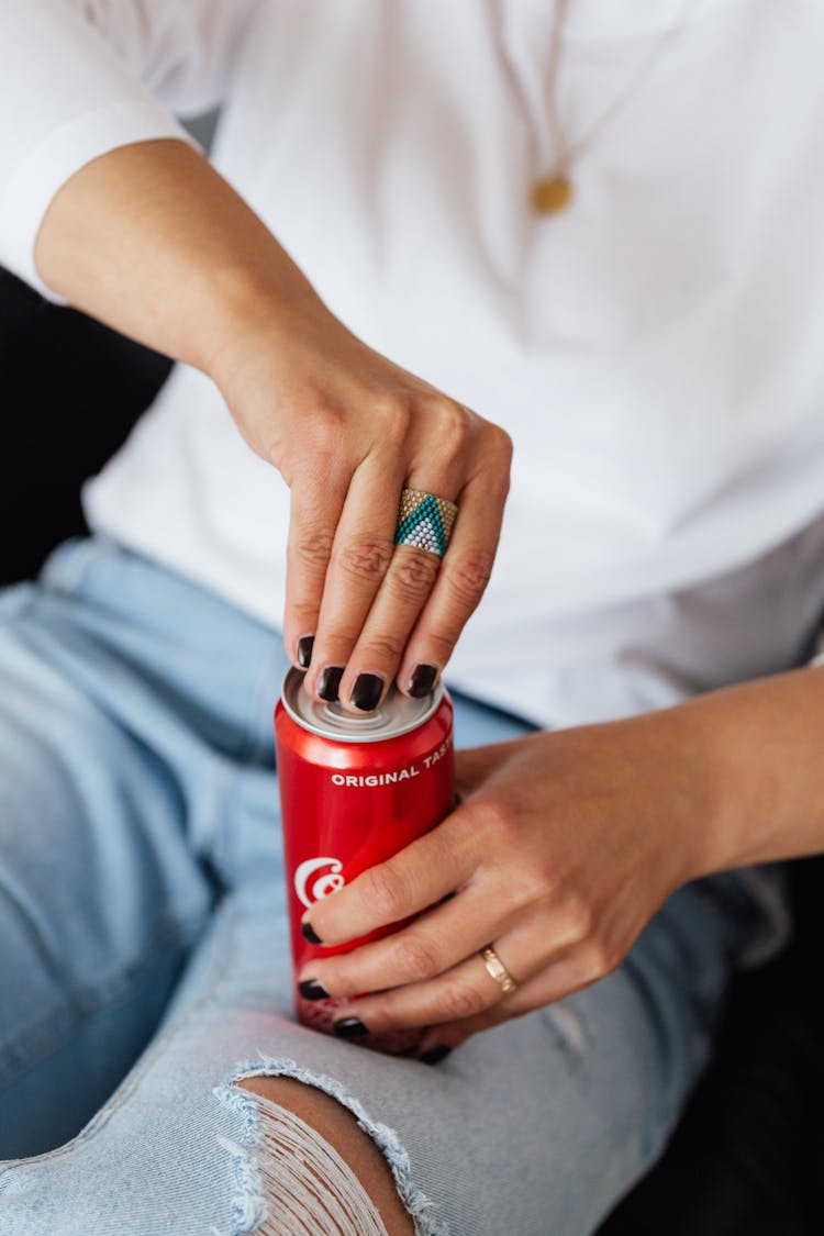 Crop Unrecognizable Woman Opening Can Of Coke