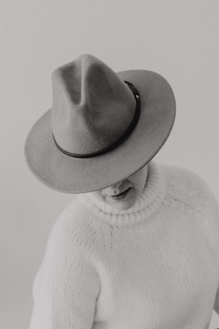 Woman In White Sweater And Hat