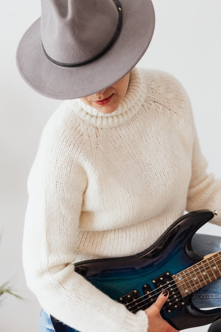 Woman Musician Performing On Electric Guitar