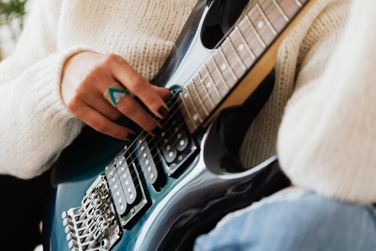 Crop Musician In Casual Wear Playing Electric Guitar