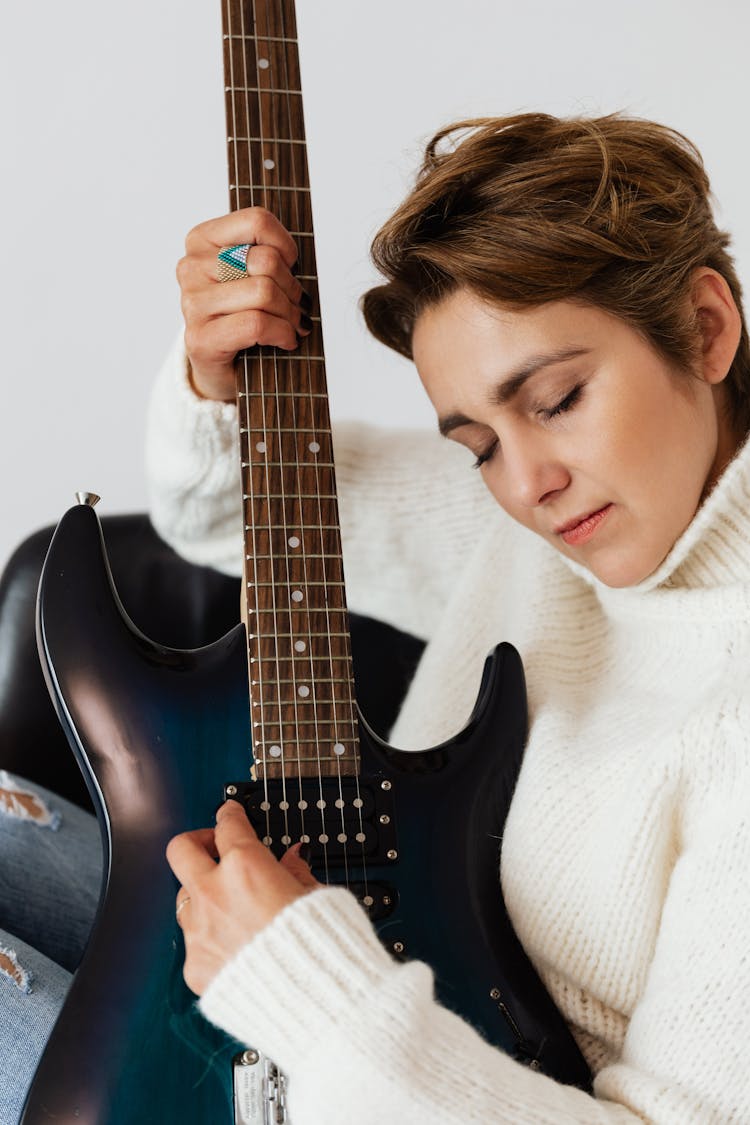 Relaxed Musician With Modern Electric Guitar