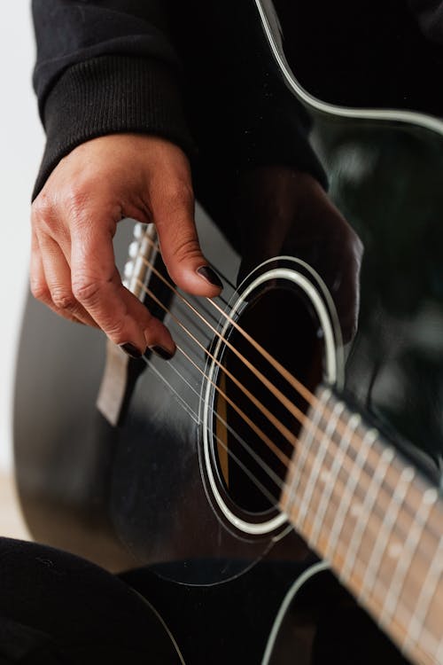 Free Person Playing Acoustic Guitar Stock Photo
