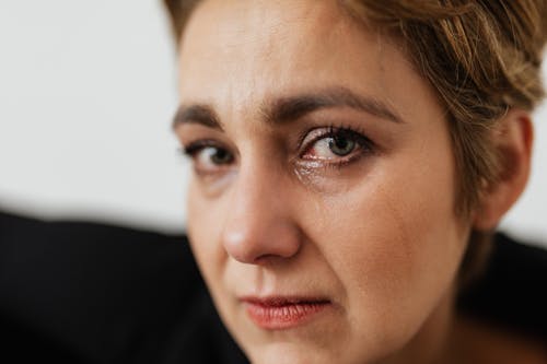Close-Up Photo of Person Crying