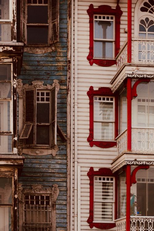 Free Austere rustic textures meet ornate Victorian design in this vertical architectural shot. Stock Photo