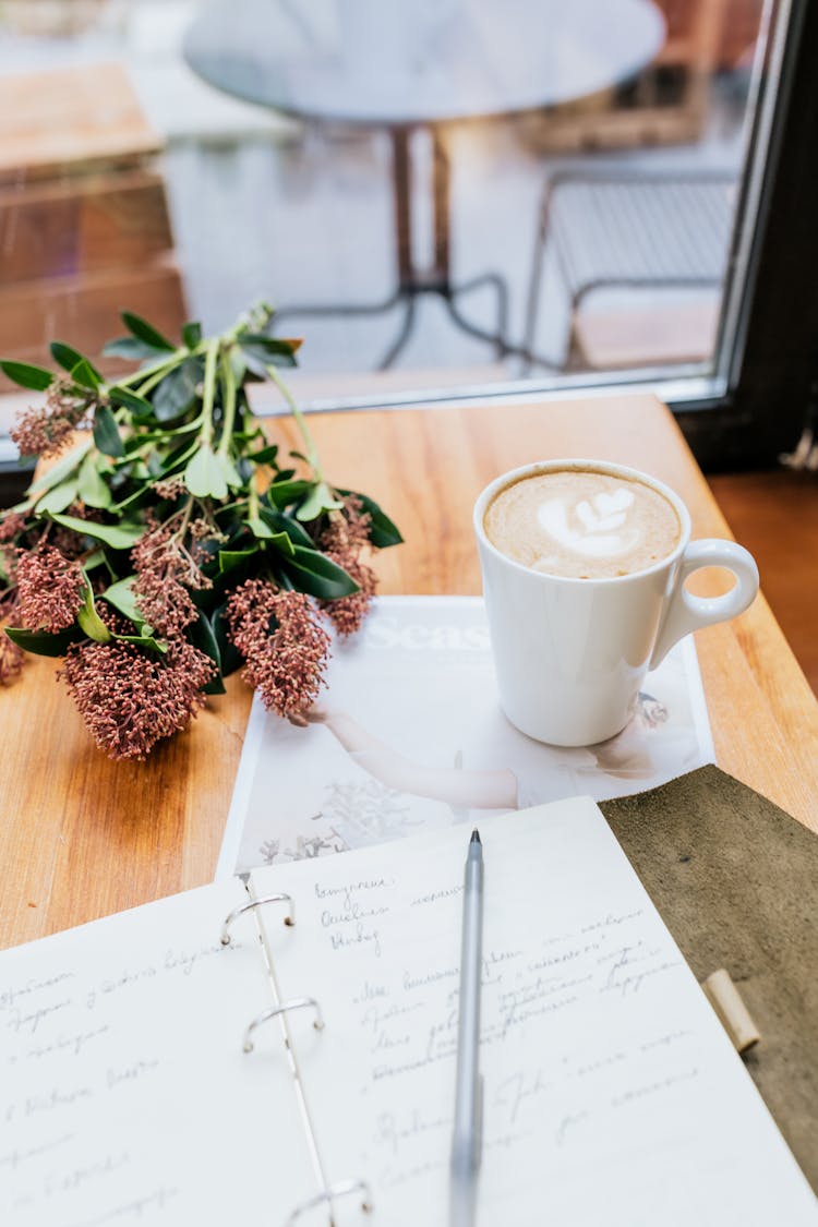 Bouquet Of Flowers And A Cup Of Coffee