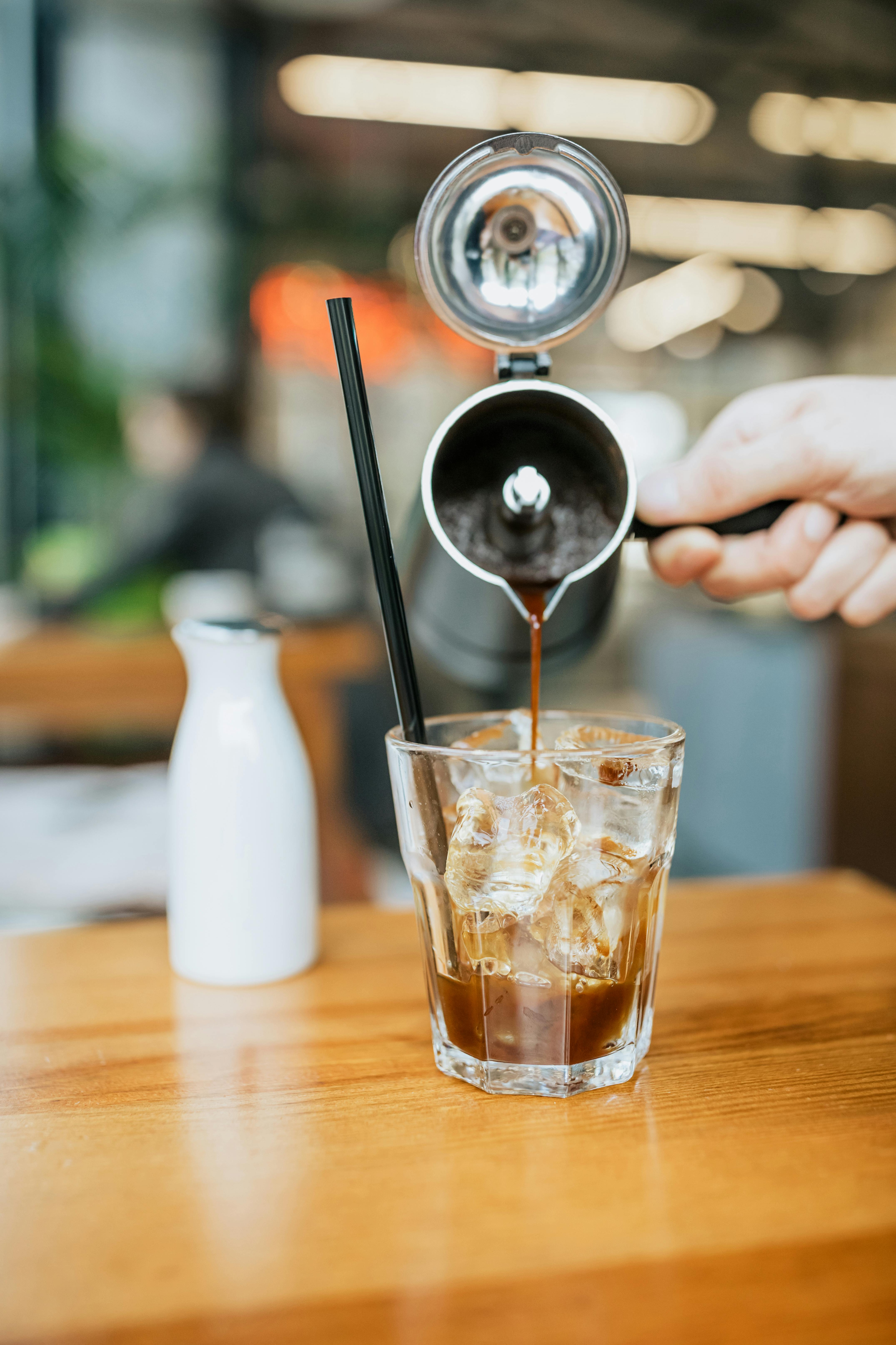 clear drinking glass with ice and ice