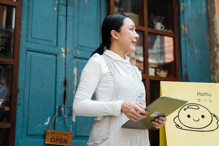 Photo Of Woman Holding Silver Tablet Computer