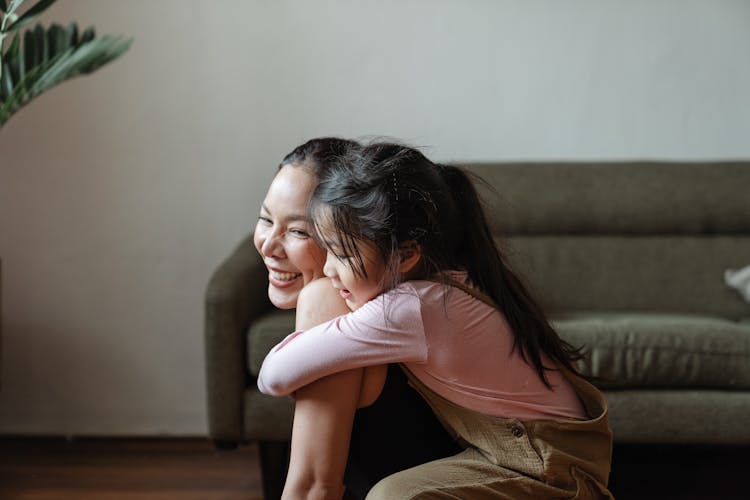 Photo Of Girl Hugging Her Mom