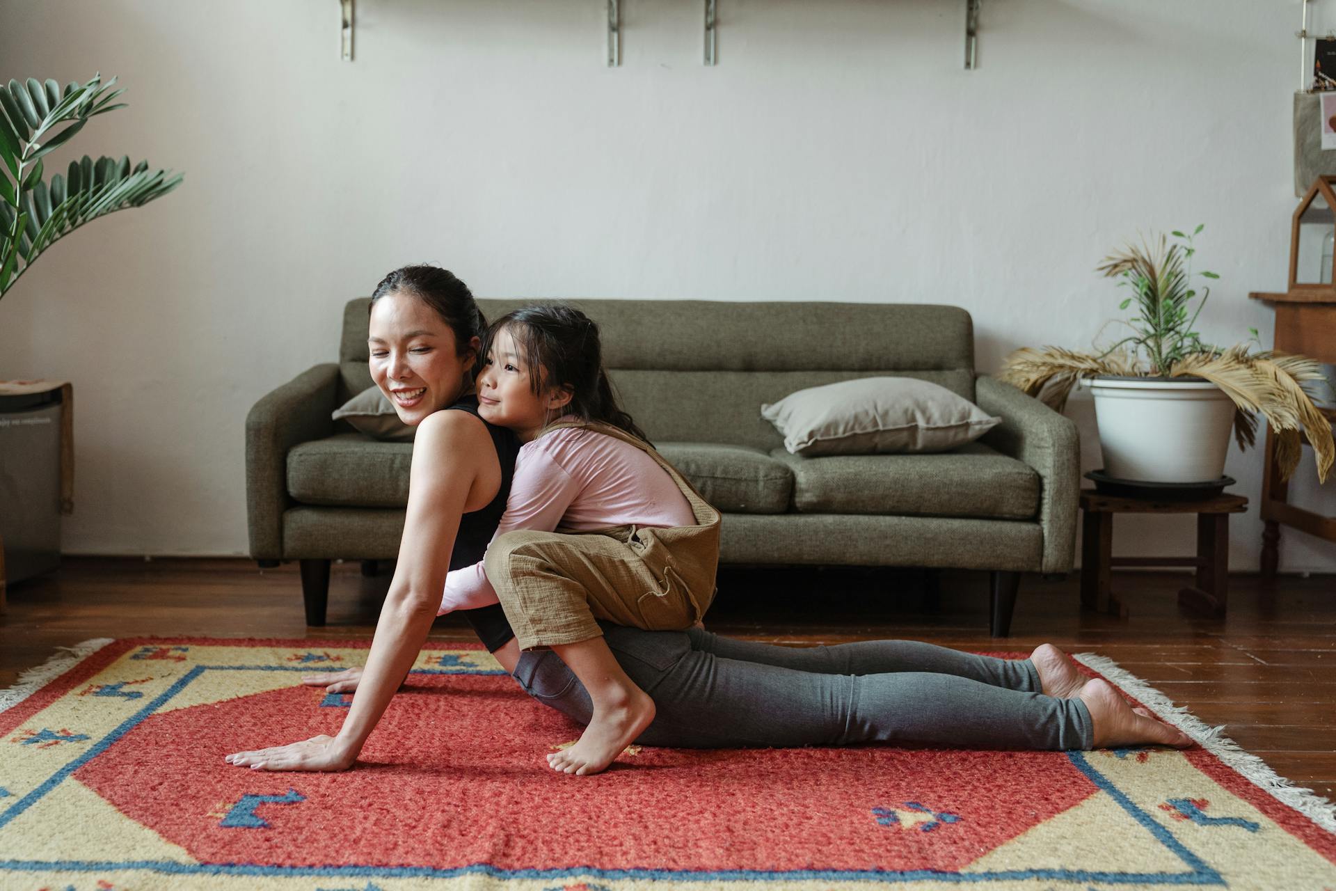 Photo of Girl Hugging Her Mom While Doing Yoga Pose