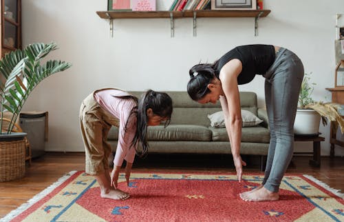 Free Photo of Woman and Girl Stretching Their Body Stock Photo