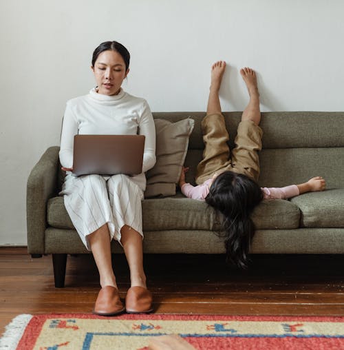 Photo Of Mother Working At Home 