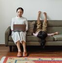 Photo Of Mother Working At Home