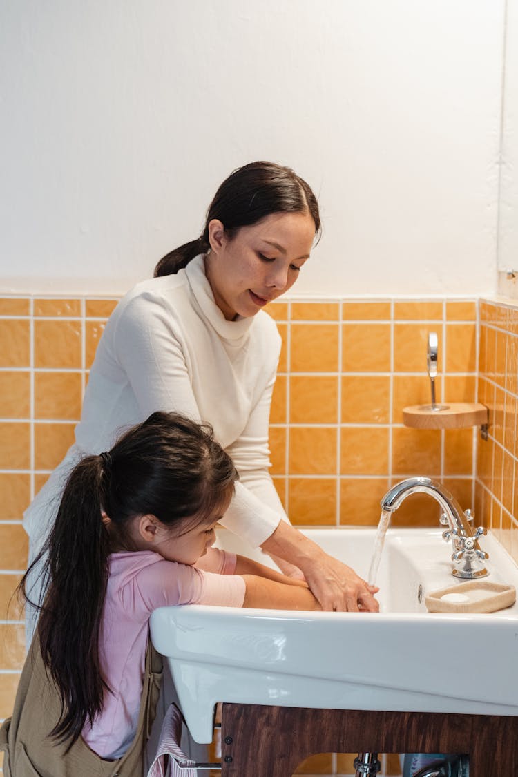 Mom Teaching Little Daughter To Wash Hands Properly