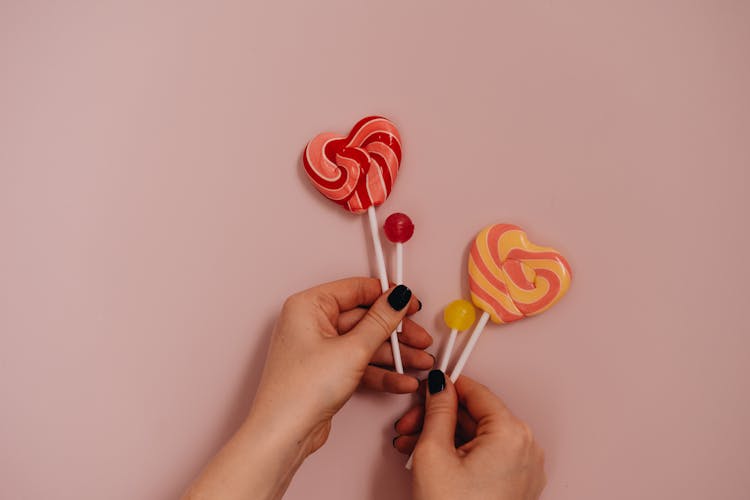 Colorful Lollipops On Pink Background 