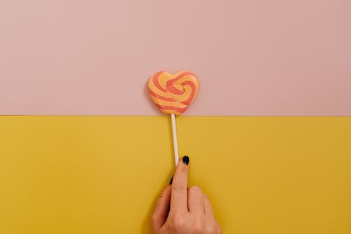Darmowe zdjęcie z galerii z cukierek, dwa kolorowe tło, lizak