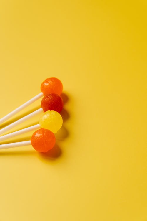 Lollipops against Yellow Background