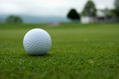 Free White Golf Ball on Green Grass Field Stock Photo