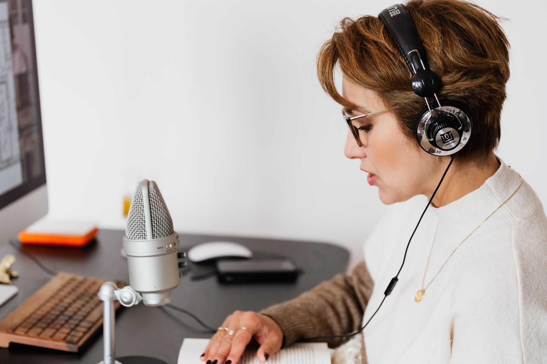 podcast listener wearing headphones contemplating