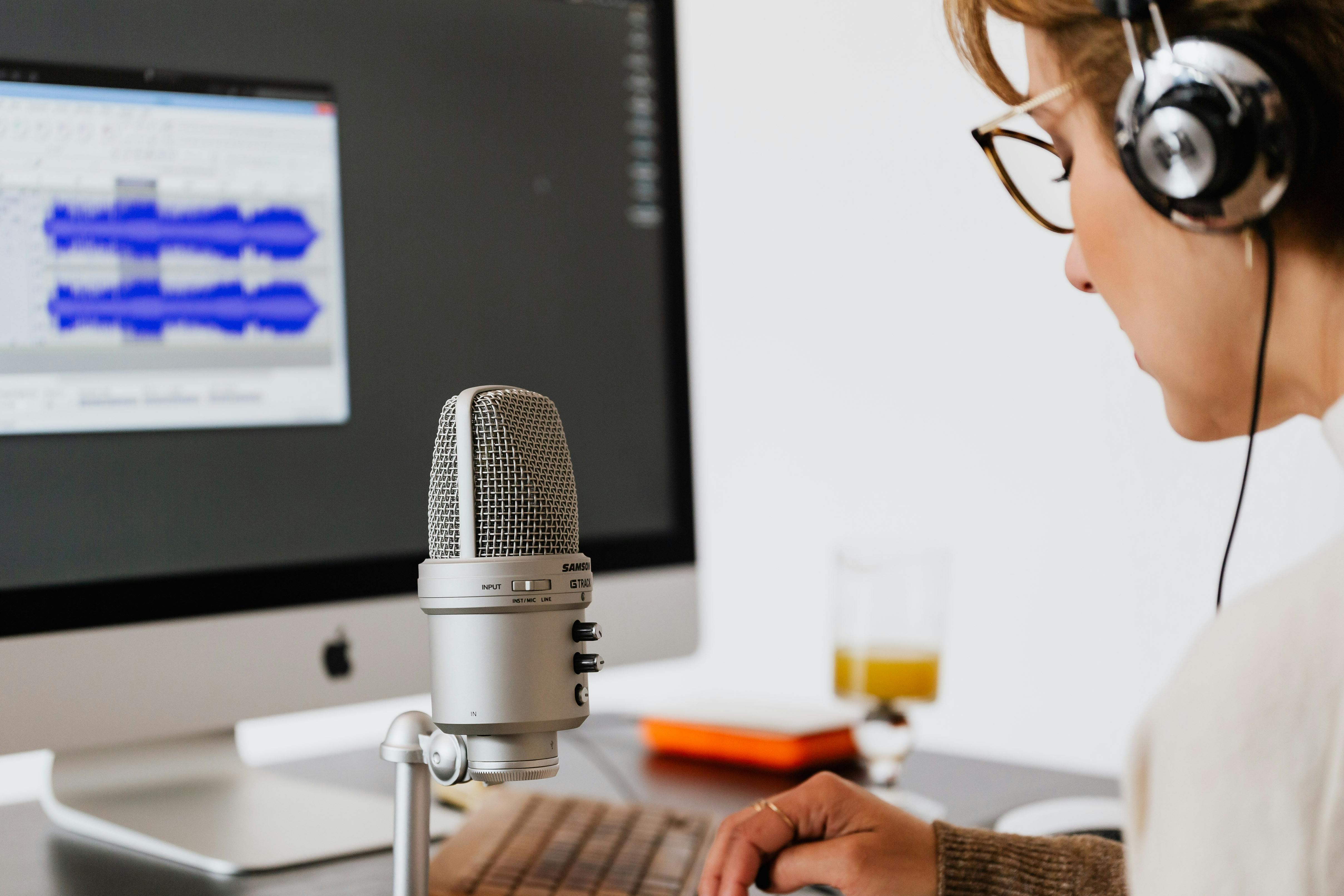 Person Using Microphone · Free Stock Photo