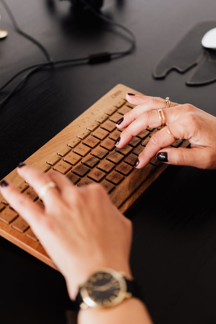 Crop Woman Typing On Modern Computer Keyboard