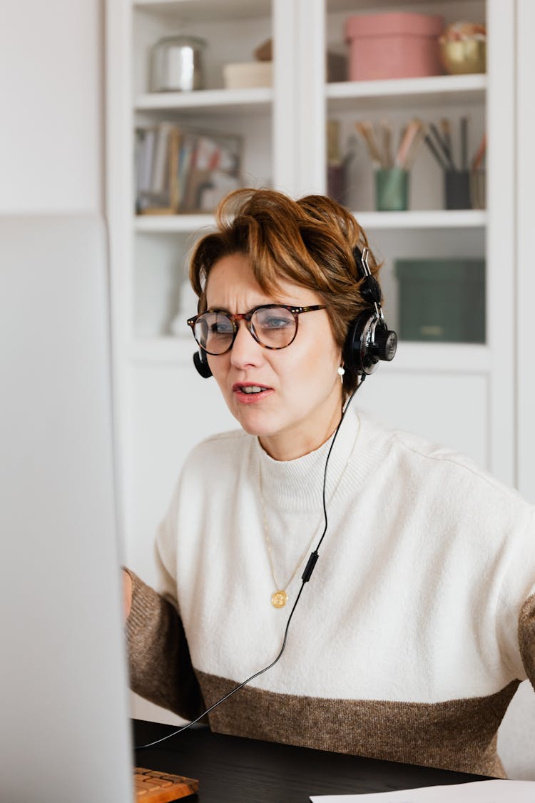 Frowning Woman Having Video Call Via Computer