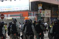 Crowd of police walking on street