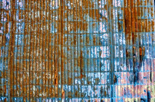 Close-up of a rusty and weathered metal surface with unique textures and colors.