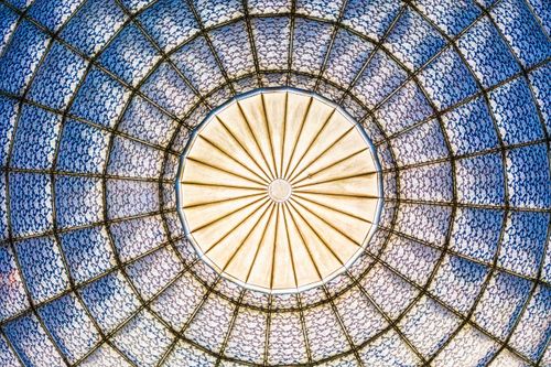 Free A vibrant geometric stained glass dome with intricate patterns, captured from below in Jakarta, Indonesia. Stock Photo