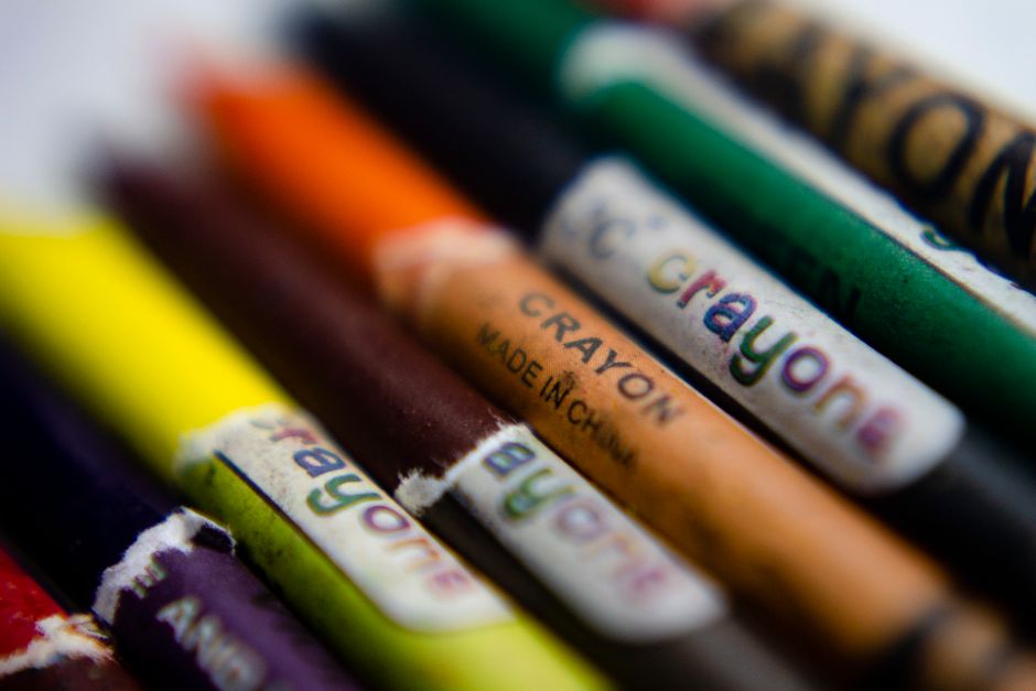 Close-up view of a variety of colorful crayons, highlighting artistic creativity.
