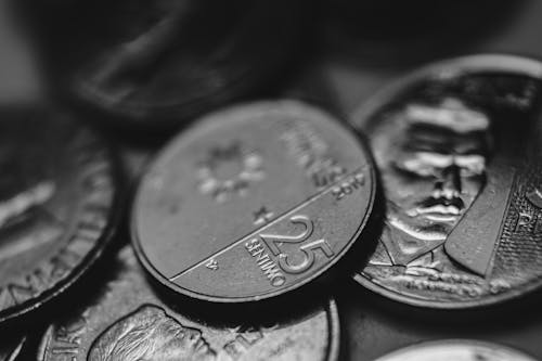 Grayscale Photo of Coins