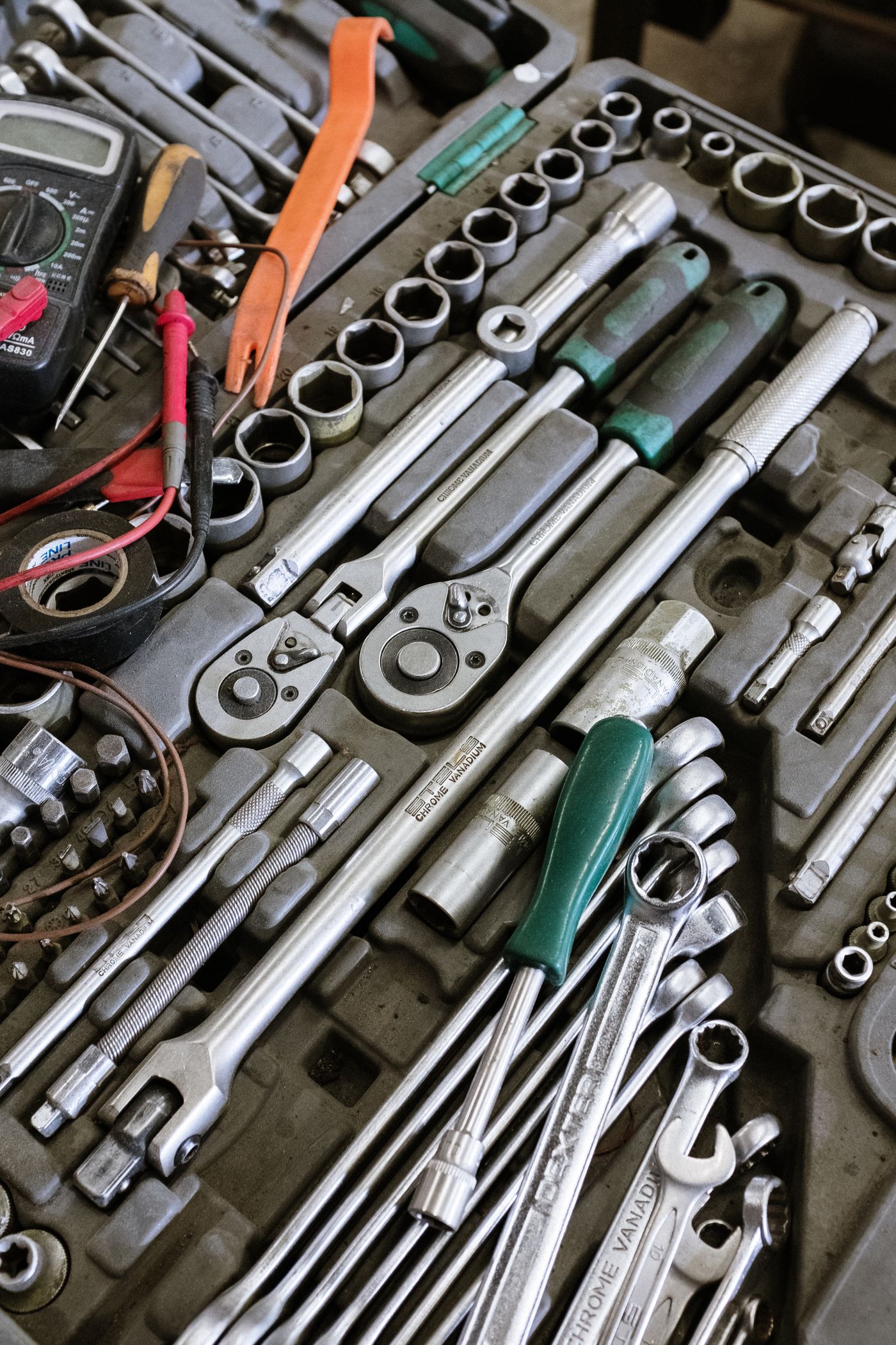 Mechanic working at a bench in an automotive workshop