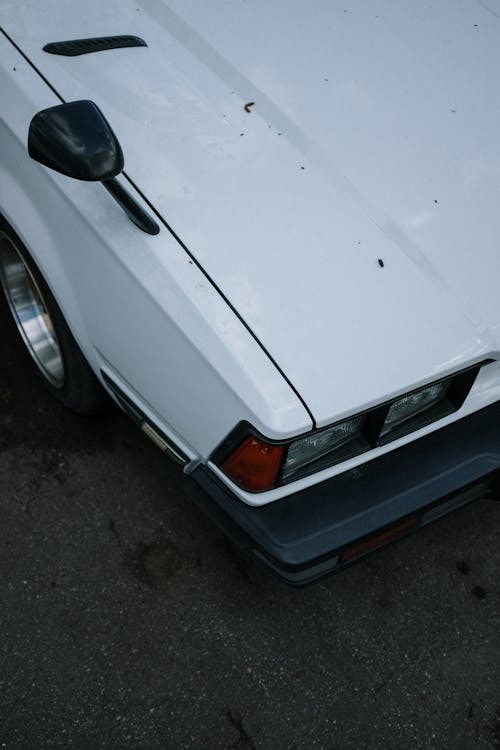 High Angle Photo of White Vintage Car