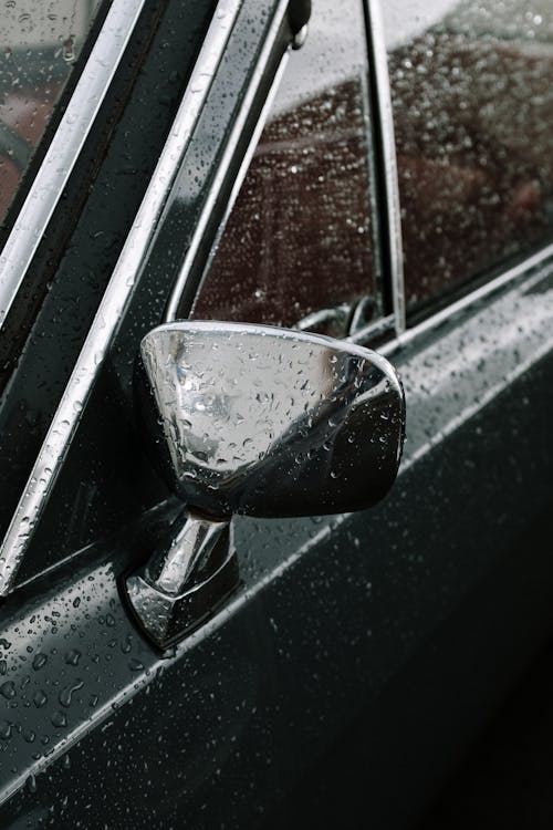 Black Car Side Mirror With Water Droplets