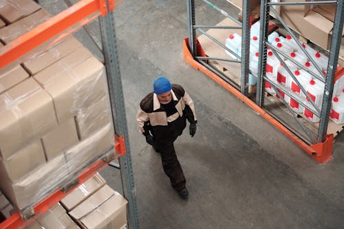 Man Walking on a Warehouse
