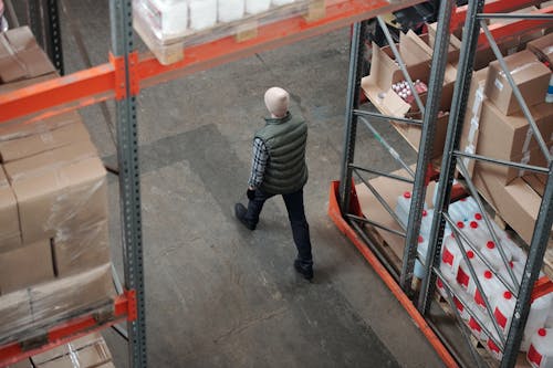Man Walking on a Warehouse