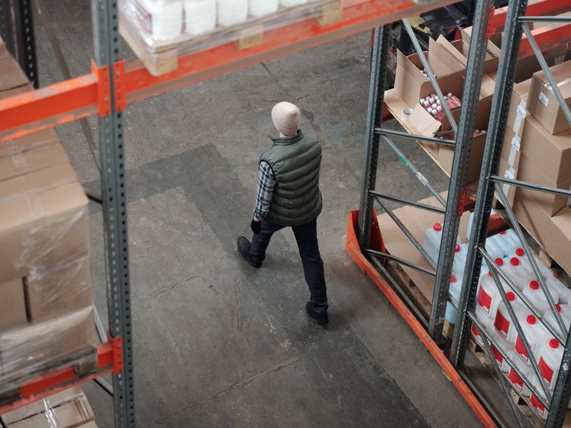 warehouse worker operating forklift