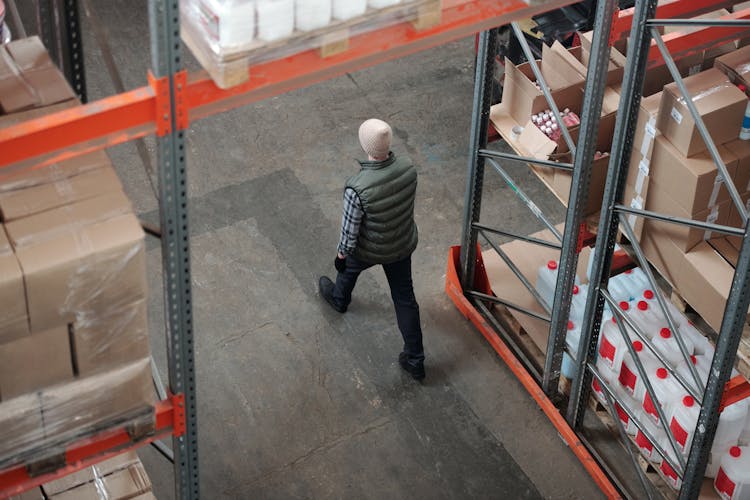 Man Walking On A Warehouse