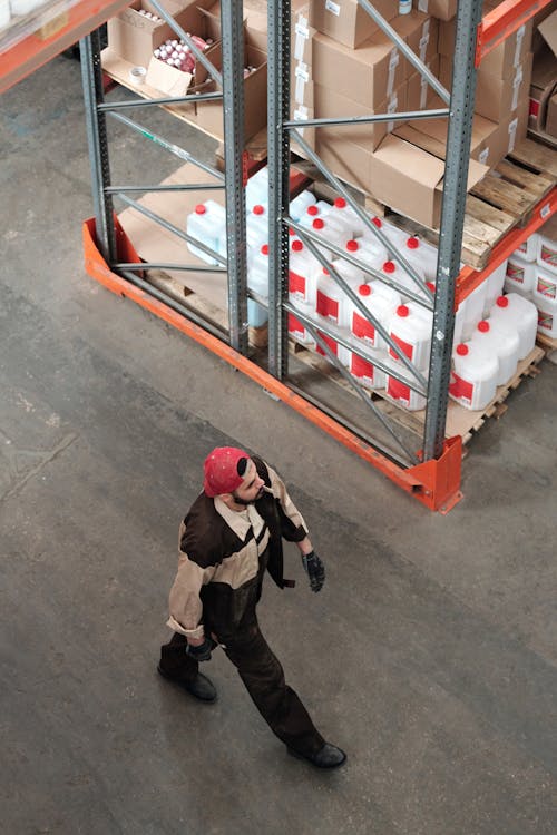 Man Walking in a Warehouse