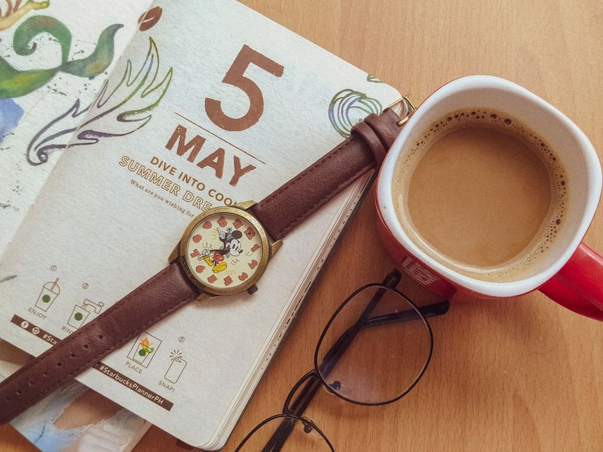 coffee mug beside planner natural light lifestyle photo 2